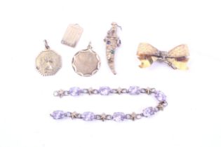 A collection of vintage gold jewellery including an Edwardian floral-engraved ribbon-tied bow fob.