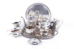 Two silver plated tea services and trays.