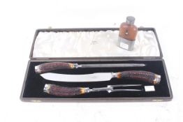 An early 20th century Walker & Hall horn handled three piece carving set.