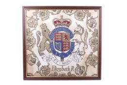 A length of fabric printed with the crest of Queen Elizabeth II.
