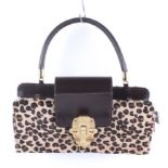 A Christian Louboutin (Paris) leopard print clutch handbag,