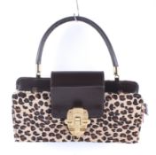 A Christian Louboutin (Paris) leopard print clutch handbag,