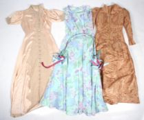 Three vintage ladies dresses.