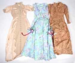 Three vintage ladies dresses.