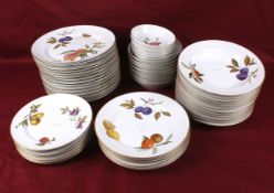 A collection of Royal Worcester porcelain Evesham dinner plates and bowls.