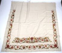 A large length of linen with crewelwork.