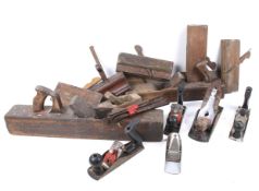 A collection of assorted carpenter's wood working planes. Including Jack and moulding planes, etc.