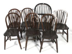 Six stained pine Windsor chairs.