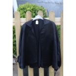 A 1920s ladies black silk jacket.