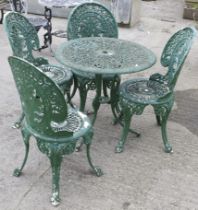 A set of matching cast metal garden table and chairs. Max.