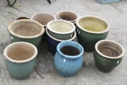 A collection of eleven assorted glazed garden plant pots. Max.