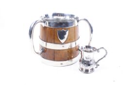 A Victorian silver christening mug and an oak tyg with plated mounts.