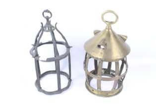 Two antique brass lantern frames.