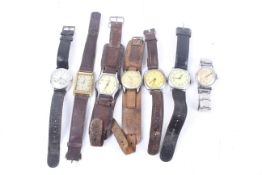 Seven 1930s and 1950s gentleman's wrist watches, some in military style.