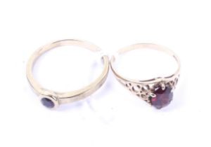 Two 9ct gold and garnet single stone rings.