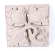 An acorn and oak leaf decorated relief ceramic tile.