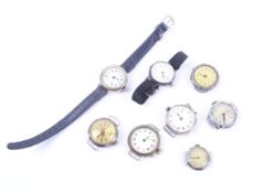A collection of eight silver (975) and white metal trench type watches