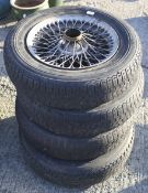 A set of four vintage MG sportscar wire wheels. With four tyres: Michelin X 165 15 Z X Radial.