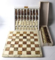 A 20th century Alabaster Stauton style chess & draughts set.