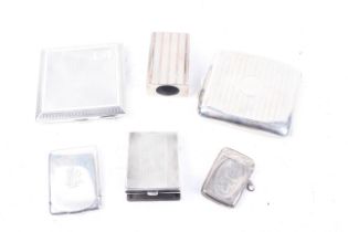 A collection of smoking related items to include two engine turned cigarette cases.