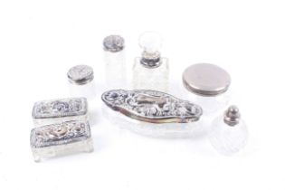 A collection of silver mounted clear cut glass dressing table jars, bottles, boxes and pots.
