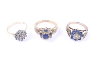 Three vintage 9ct gold, blue and colourless stone cluster rings.