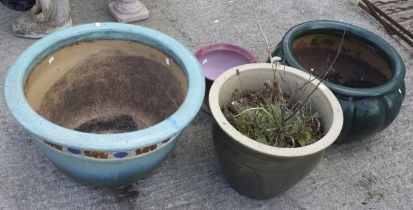 Four assorted large glazed garden pots. Max.