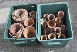 A group of terracotta garden plant pots. Various sizes, in two boxes.