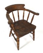 A late 19th or early 20th Century smokers bow open armchair.