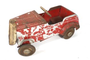 A vintage Tri-ang child's ride-on toy car.
