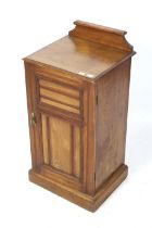 A 20th century oak pot cupboard.