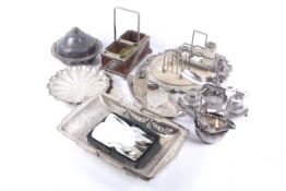 A collection of silver plate including an ink stand with a gun dog.