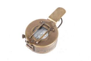 A WWII Mk II TG Co Ltd London brass compass, fated 1941. Diam of case 6.2cm.