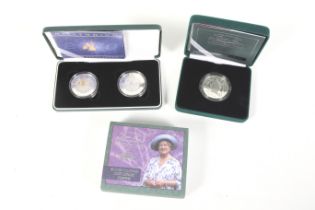 Silver proof £5 coins: Two millennium crowns and a queen mother centenary crown (three coins)