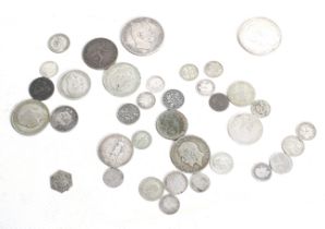 A collection of assorted silver coins. Including Prussia 1876 5 Marks, pre-decimal GB and European.