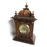 An early 20th century German oak cased mantel clock.