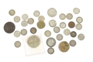 A group of manly silver coins.