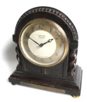 A Smith's carved wood cased mantel clock.