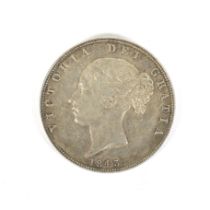 An 1843 half crown coin; obverse lightly cleaned.