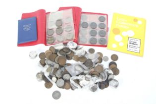 A group of pre-1947 silver coins and pennies.