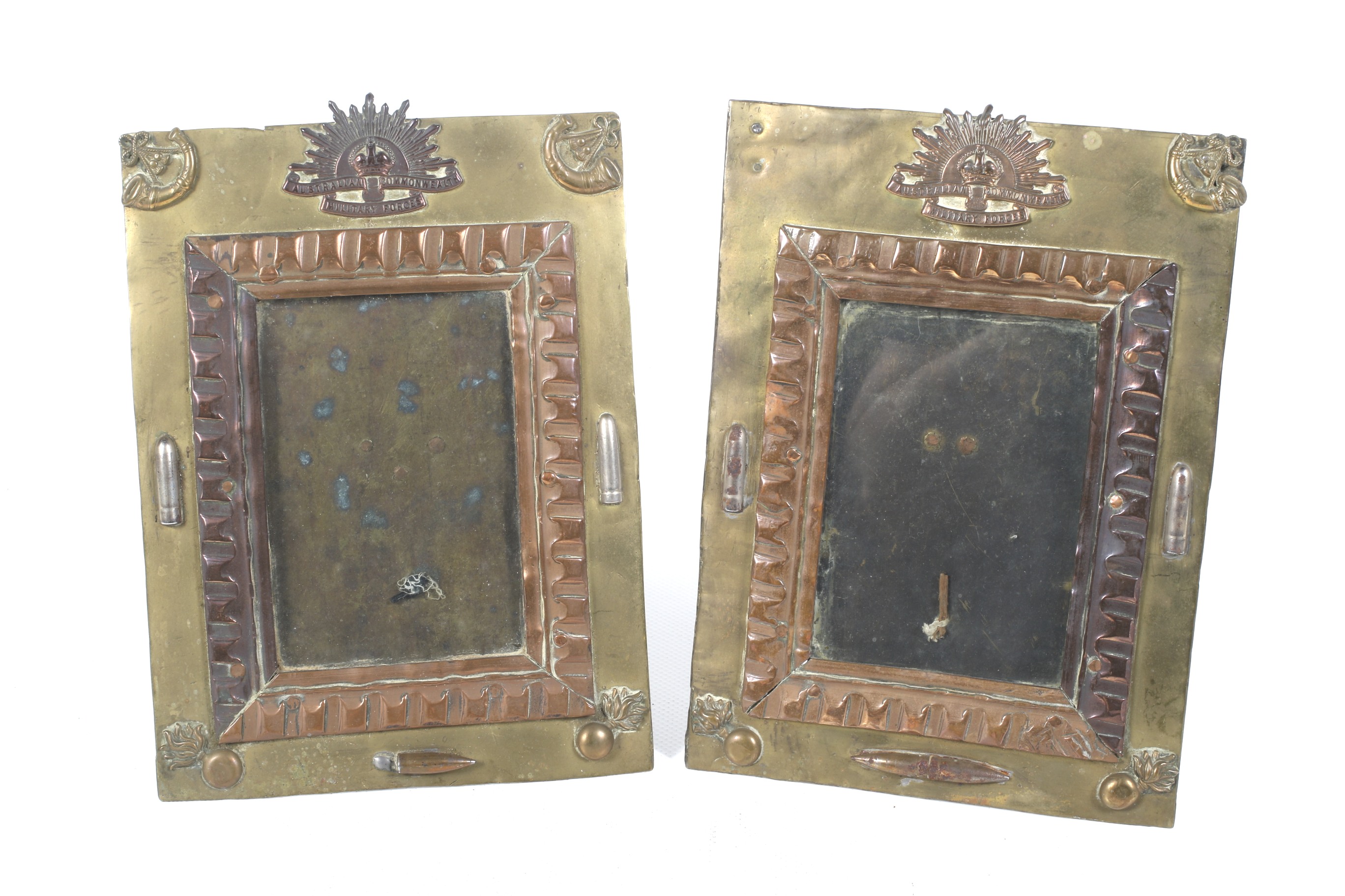 A pair of Trench Art photograph frames.