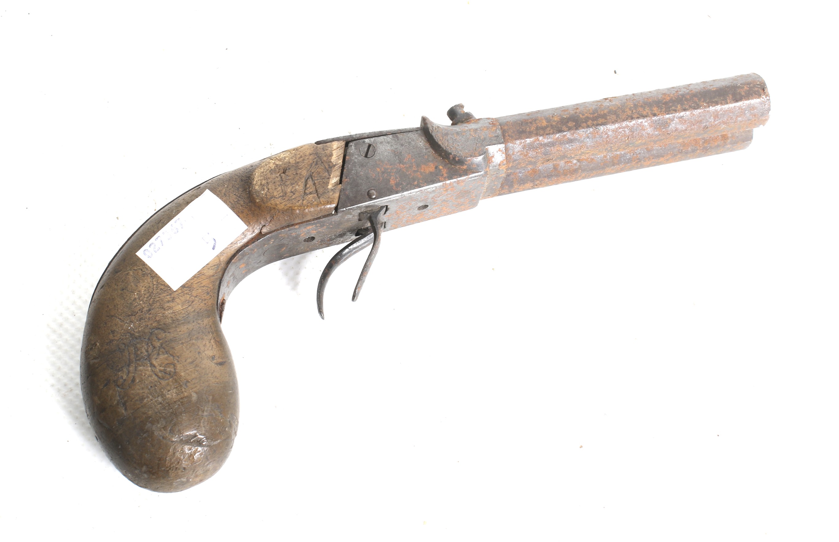 A double barrel percussion pistol. Circa 1860, with octagonal barrels, ideal restoration project.