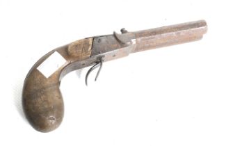 A double barrel percussion pistol. Circa 1860, with octagonal barrels, ideal restoration project.