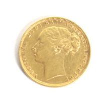 An 1884 full gold Sovereign coin.