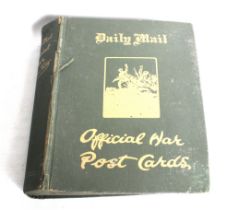 A large collection of WWI Daily Mail Official War Postcards in an album.