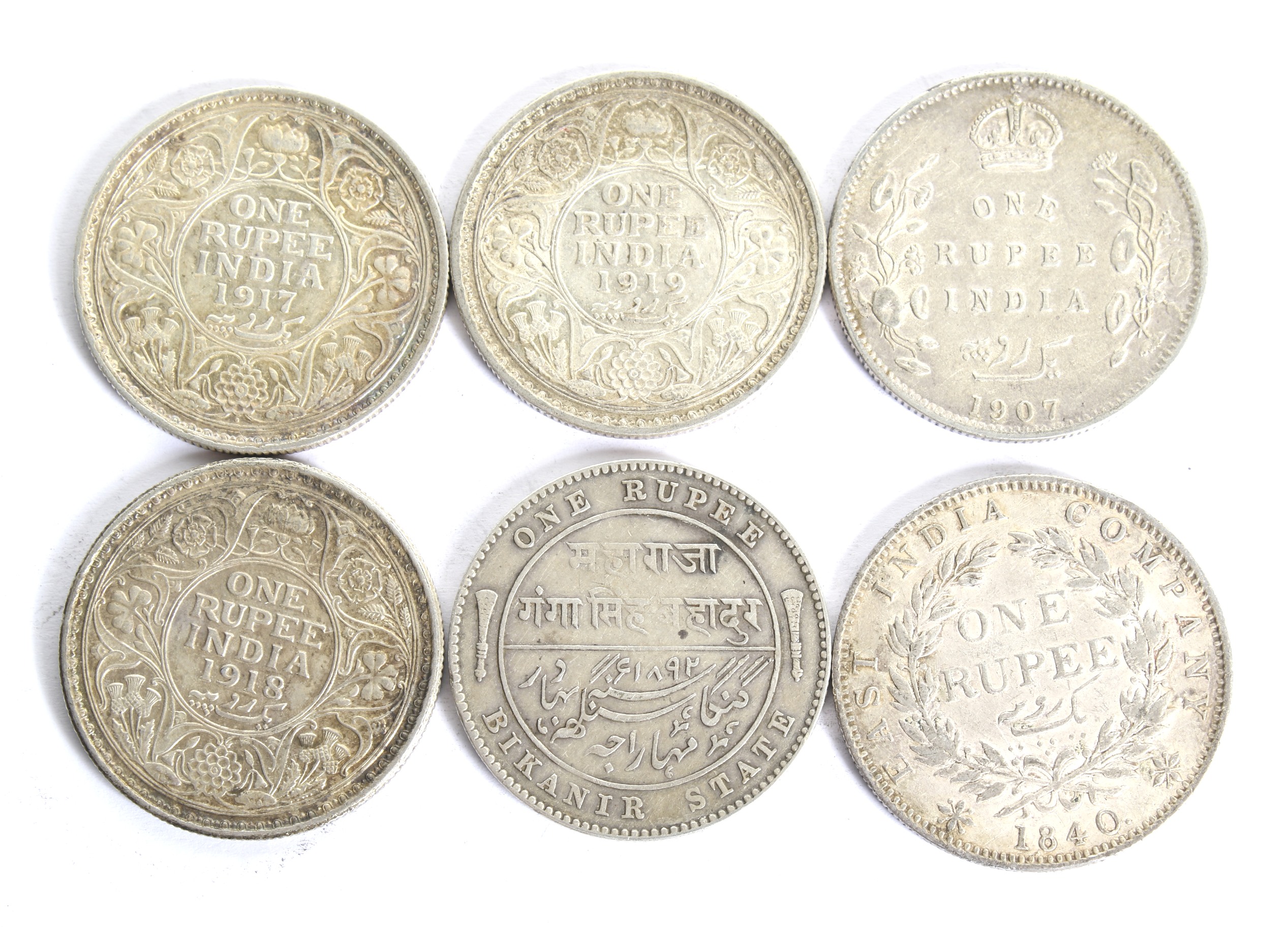 A group of six Indian Rupees coins. Dated 1840; 1907; 1917; 1918; 1919 and Bikanir Victoria Rupee. - Image 2 of 2