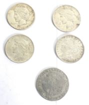 Four USA silver Dollar coins.