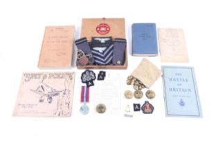 A group of WWII military items.