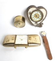 Three small clocks and a vintage wristwatch.