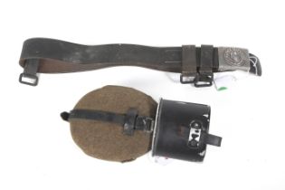 A WWII German army leather belt and buckle and a water bottle.